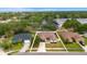 Aerial view of a single Gathering home with a well manicured yard and mature landscaping at 3011 49Th S Ter, St Petersburg, FL 33712