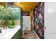 This bathroom features bold floral wallpaper, modern vanity, and stylish fixtures at 3011 49Th S Ter, St Petersburg, FL 33712