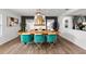 Dining room with a wooden table, modern chairs, and stylish decor at 3011 49Th S Ter, St Petersburg, FL 33712