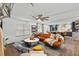 Spacious living room with a leather sofa and open floor plan leading to the kitchen at 3011 49Th S Ter, St Petersburg, FL 33712