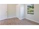 Bright bedroom with a closet and wood laminate flooring at 3103 E Emma St, Tampa, FL 33610