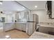 Spacious kitchen boasting stainless appliances and stone countertops at 3103 E Emma St, Tampa, FL 33610