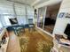 The bright sunroom provides access to the main living area and features a great view of the outdoors at 34222 Canal N Dr, Pinellas Park, FL 33781