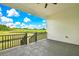 View from the back porch featuring black metal railing and scenic views of the green outdoor landscape at 38151 Sunset Ave, Dade City, FL 33525
