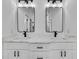 Bright bathroom featuring a double vanity with modern black fixtures and quartz countertops at 38151 Sunset Ave, Dade City, FL 33525