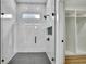 Sleek walk-in shower with gray tile floor and a view to the walk-in closet at 38151 Sunset Ave, Dade City, FL 33525