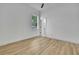Cozy bedroom with window view and open doorway to an ensuite at 38151 Sunset Ave, Dade City, FL 33525
