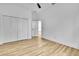 Spacious bedroom with wood-look floors and large closets at 38151 Sunset Ave, Dade City, FL 33525