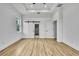 Bedroom featuring wood-look floors and sliding barn doors to the closet and bathroom at 38151 Sunset Ave, Dade City, FL 33525