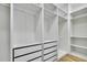 Walk-in closet featuring modern storage systems including shelving, drawers, and hanging rods at 38151 Sunset Ave, Dade City, FL 33525