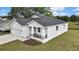 Attractive home showcasing an attached garage and landscaped front yard at 38151 Sunset Ave, Dade City, FL 33525