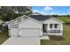 Charming single-Gathering home featuring a two-car garage and lovely landscaping at 38151 Sunset Ave, Dade City, FL 33525