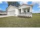 This single-Gathering home includes an attached garage and a well-kept lawn at 38151 Sunset Ave, Dade City, FL 33525