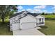 Beautiful home featuring a two-car garage and well-maintained lawn at 38151 Sunset Ave, Dade City, FL 33525