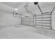 Bright garage with three car capacity and garage doors at 38151 Sunset Ave, Dade City, FL 33525