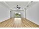 Spacious living room with ample natural light and sliding glass doors leading to the balcony at 38151 Sunset Ave, Dade City, FL 33525