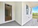 Inviting front porch with a view into the interior, bright windows, and brick accents at 38151 Sunset Ave, Dade City, FL 33525