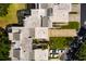 An aerial view of a home featuring a screened in pool area, mature trees, and multiple car parking at 4207 Fairway Run, Tampa, FL 33618