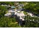 An aerial view of a townhome with a screened-in back patio and mature trees at 4207 Fairway Run, Tampa, FL 33618
