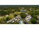 Aerial view of Fairway Townhouses, highlighting lush landscaping, community pool, and proximity to the golf course at 4207 Fairway Run, Tampa, FL 33618
