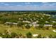 Aerial view of Fairway Townhouses in the golf course with lush trees and landscaping at 4207 Fairway Run, Tampa, FL 33618