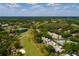 Aerial view of Fairway Townhouses showcasing a golf course, water features, and mature landscaping at 4207 Fairway Run, Tampa, FL 33618