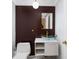 Stylish powder room features modern vanity, unique glass bowl sink, and designer lighting at 4207 Fairway Run, Tampa, FL 33618
