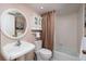 Bright bathroom featuring a pedestal sink, white fixtures, and a shower-tub combo at 4207 Fairway Run, Tampa, FL 33618