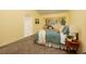 Cozy bedroom with carpet, natural light and a comfortable bed, creating a relaxing atmosphere at 4207 Fairway Run, Tampa, FL 33618