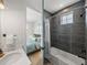 View from ensuite bathroom featuring a marble vanity and adjacent bedroom with tasteful artwork at 4215 Saltwater Pearl Way, Cortez, FL 34215