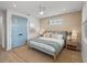 Cozy bedroom with woven headboard, a blue accent blanket, and neutral walls at 4215 Saltwater Pearl Way, Cortez, FL 34215