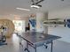 Multi-purpose garage setup with a sauna, ping pong table, and exercise equipment at 4215 Saltwater Pearl Way, Cortez, FL 34215