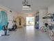 Spacious garage featuring a sauna, bikes, and paddle boards for recreation at 4215 Saltwater Pearl Way, Cortez, FL 34215