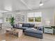 Comfortable living room featuring plush sofa, natural light, and stylish decor, creating a relaxing atmosphere at 4215 Saltwater Pearl Way, Cortez, FL 34215