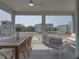 Inviting screened patio with dining area and comfortable lounge furniture, offering pleasant outdoor living at 4215 Saltwater Pearl Way, Cortez, FL 34215