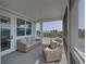 Relaxing screened porch with comfortable seating and peaceful outdoor views at 4215 Saltwater Pearl Way, Cortez, FL 34215