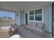 This screened porch offers a tranquil outdoor seating area, perfect for enjoying the fresh air and neighborhood views at 4215 Saltwater Pearl Way, Cortez, FL 34215