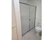 Updated bathroom featuring shower with sliding glass door and toilet at 607 Manchester Woods Dr # 84, Sun City Center, FL 33573