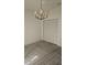 Bright bedroom featuring chandelier lighting and closet space at 607 Manchester Woods Dr # 84, Sun City Center, FL 33573