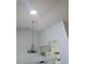 High ceiling with a skylight and a chandelier in the dining area at 607 Manchester Woods Dr # 84, Sun City Center, FL 33573