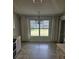 Bright dining area with chandelier and window view to landscaped outdoors at 607 Manchester Woods Dr # 84, Sun City Center, FL 33573
