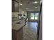 Kitchen boasts updated stainless appliances and natural light at 607 Manchester Woods Dr # 84, Sun City Center, FL 33573