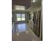 Spacious kitchen with light cabinets and stainless-steel appliances at 607 Manchester Woods Dr # 84, Sun City Center, FL 33573