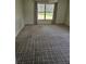 Spacious living room with large window and ample natural light at 607 Manchester Woods Dr # 84, Sun City Center, FL 33573