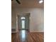 Living room features wood floors, a chandelier, and neutral paint at 607 Manchester Woods Dr # 84, Sun City Center, FL 33573