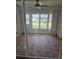 Cozy sunroom with tile floors and ample natural light at 607 Manchester Woods Dr # 84, Sun City Center, FL 33573