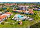Beautiful aerial view of a condo community with pool, lush landscaping, and tropical feel at 6357 Bahia Del Mar Blvd # 403, St Petersburg, FL 33715