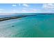Stunning aerial view of a bridge spanning over clear blue water with boats sailing under a clear sky at 6357 Bahia Del Mar Blvd # 403, St Petersburg, FL 33715