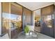 Balcony with outdoor seating, views of a lake, palm trees and open access to the living room at 6357 Bahia Del Mar Blvd # 403, St Petersburg, FL 33715