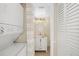 Bathroom with vanity, mirror, lighting, and nearby stacked washer and dryer at 6357 Bahia Del Mar Blvd # 403, St Petersburg, FL 33715